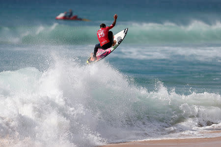 FILE PHOTO: Italo Ferreira from Brazil surfs a wave during the WSL championship at Supertubo beach in Peniche, Portugal October 20, 2018. REUTERS/Pedro Nunes/File Photo
