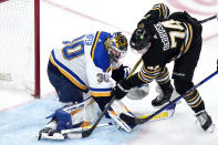 St. Louis Blues goaltender Joel Hofer (30) makes a skate save on a shot by Boston Bruins left wing Jake DeBrusk (74) during the second period of an NHL hockey game, Monday, March 11, 2024, in Boston. (AP Photo/Charles Krupa)