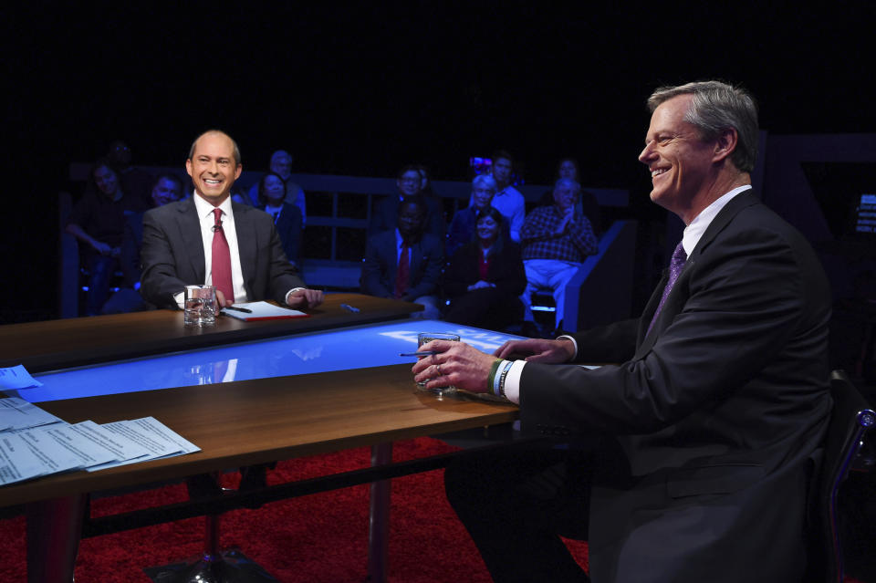 CORRECTS NAME OF STATION TO WGBH-TV IN FIRST REFERENCE FROM WBGH-TV - Republican Massachusetts Gov. Charlie Baker, right, and Democratic challenger Jay Gonzalez wait to be introduced prior to a televised debate at the studios of WGBH-TV in Boston, Wednesday Oct. 17, 2018. (Meredith Nierman/WGBH-TV via AP, Pool)