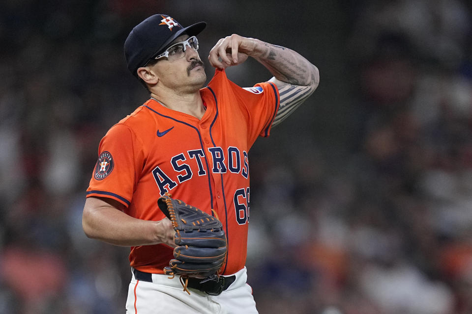 Houston Astros starting pitcher J.P. France walks around the mound after issuing a bases-loaded walk to Texas Rangers' Josh Smith during the third inning of a baseball game Friday, April 12, 2024, in Houston. (AP Photo/Kevin M. Cox)