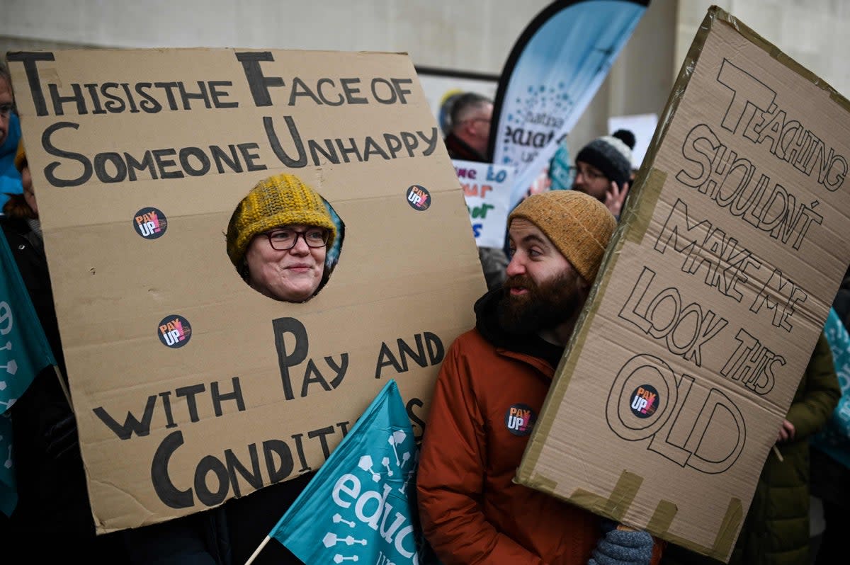 1 February 2023: Teachers hold placards as they shout slogans while taking part in a protest organised in Manchester as part of a national strike day. (AFP/Getty)