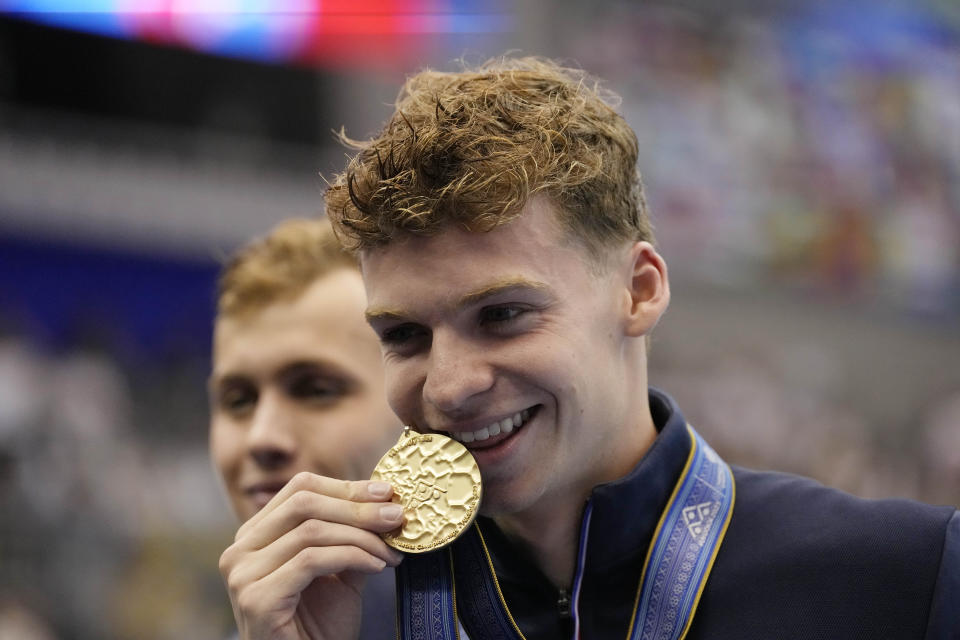 Gold medallist Leon Marchand of France celebrates during medal ceremony after winning Men's 400m Individual Medley finals at the World Swimming Championships in Fukuoka, Japan, Sunday, July 23, 2023. (AP Photo/Lee Jin-man)