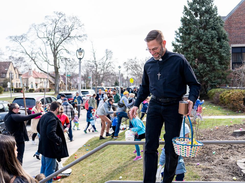 The Rev. Mike Schleider makes an announcement to begin the annual Washington Heights Easter Egg Hunt at Mount Olive Lutheran Church on April 8, 2023, in Milwaukee.