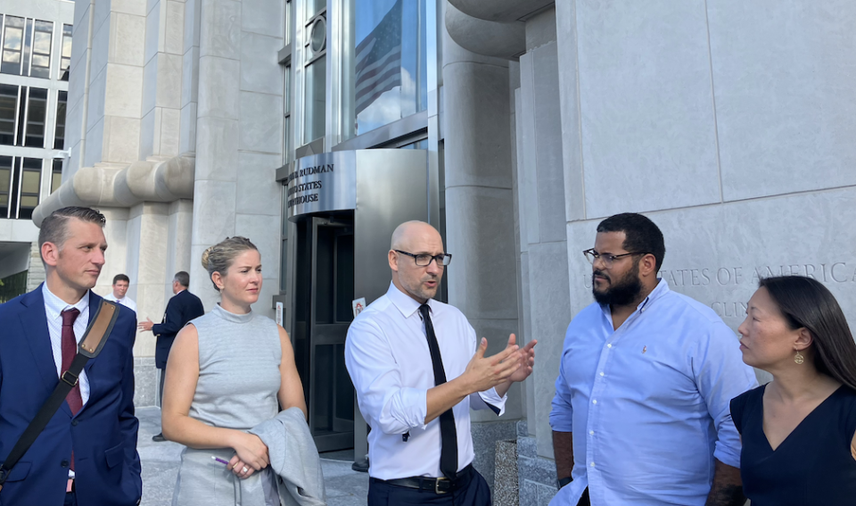 Gilles Bissonnette (center), legal director for the American Civil Liberties Union of New Hampshire, speaks outside the U.S. District Court for the District of New Hampshire after oral arguments in a lawsuit against the “banned concepts” law on Sept. 14, 2022.