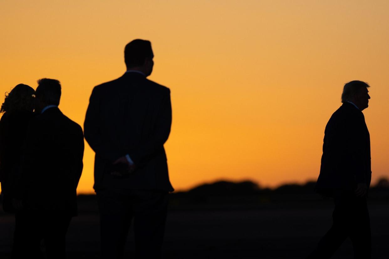 waco, texas march 25 former us president donald trump prepares to exit after speaking during a rally at the waco regional airport on march 25, 2023 in waco, texas former us president donald trump attended and spoke at his first rally since announcing his 2024 presidential campaign today in waco also marks the 30 year anniversary of the weeks deadly standoff involving branch davidians and federal law enforcement 82 davidians were killed, and four agents left dead photo by brandon bellgetty images