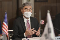 U.S. special representative for North Korea Sung Kim, speaks to South Korea's Special Representative for Korean Peninsula Peace and Security Affairs Noh Kyu-duk during their bilateral meeting at a hotel in Seoul Monday, June 21, 2021. (Jung Yeon-je/Pool Photo via AP)