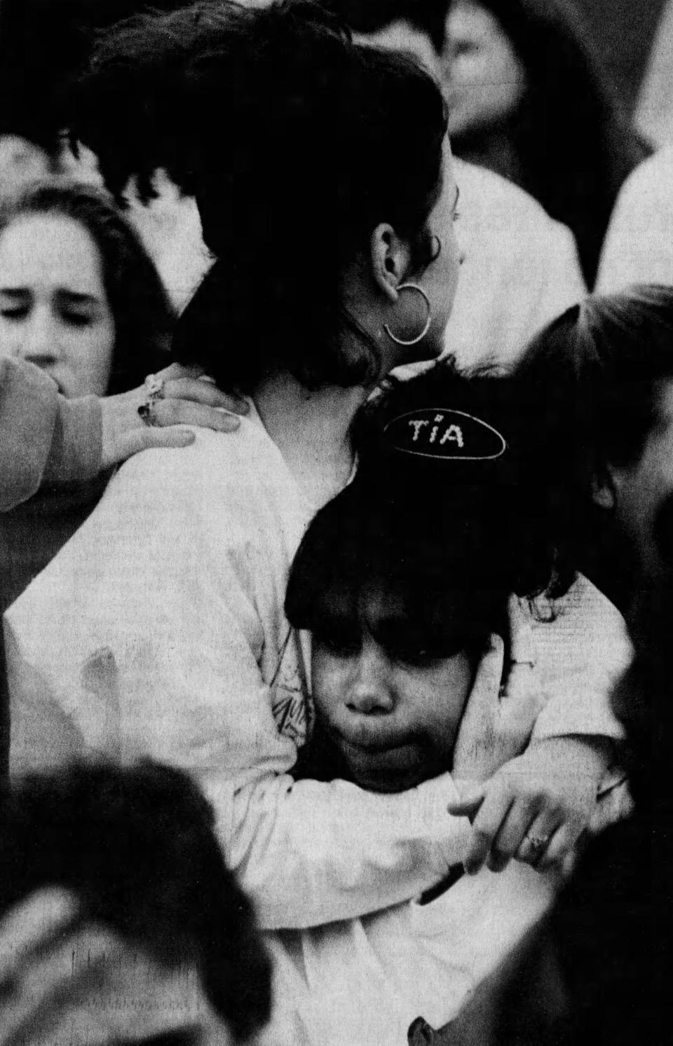 Elizabeth Polanco, left, comforts Quintia McLeod during a student protest at Bridgewater-Raritan High School on Monday, May 4, 1992. About 1,200 students walked out of class for about 45 minutes to protest the Rodney King verdict.