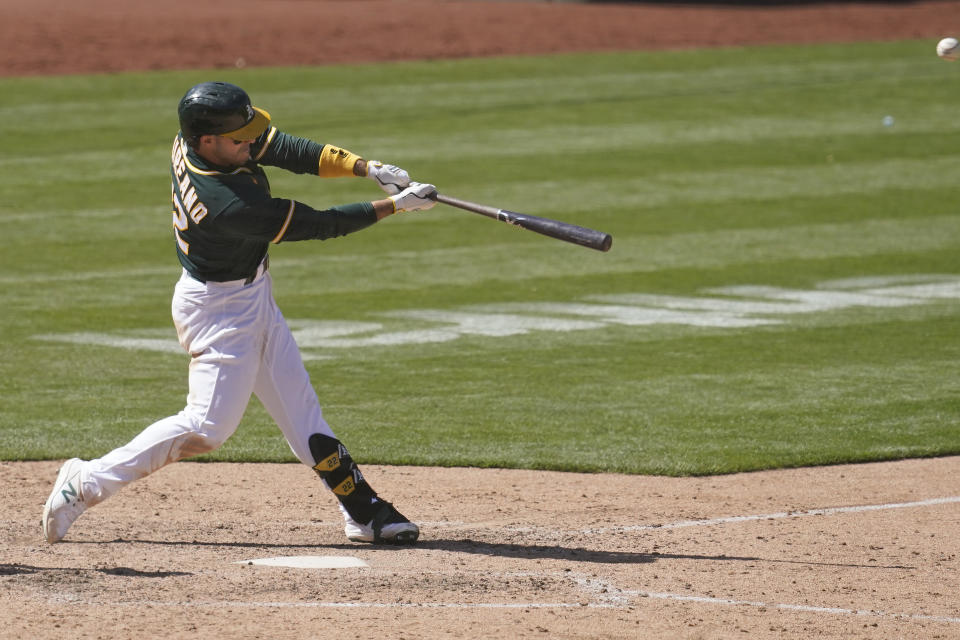 Oakland Athletics' Ramon Laureano hits a two-run home run against the Baltimore Orioles during the eighth inning of a baseball game in Oakland, Calif., Sunday, May 2, 2021. (AP Photo/Jeff Chiu)