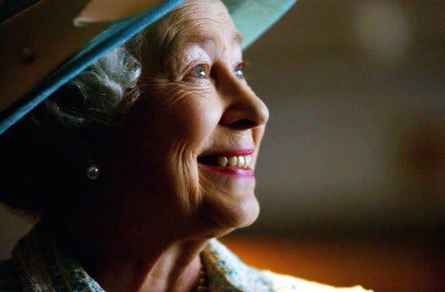 Queen Elizabeth II meets British Airways dignitaries during a visit to Heathrow Airport in 2004 to mark the 10th anniversary of UNICEF and British Airways' Change for Good program. (Photo: Chris Young/AFP via Getty Images)