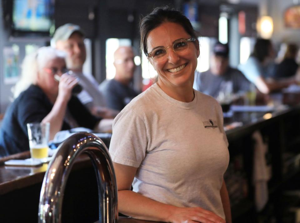 Angela LoBianco-Barone, co-owner of Hyde Park Brewing Company, at the restaurant's bar on June 15, 2022. LoBianco-Barone announced through a Facebook post that they will cease operation on June 18.
