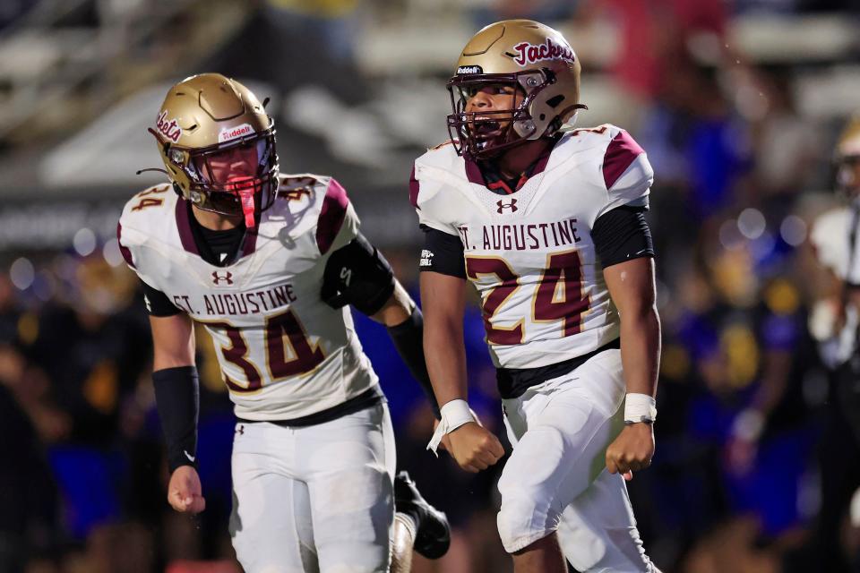 St. Augustine's Caleb Price (24) reacts from his interception next to Matteo Bernardi (34) in the Border Classic against Brunswick on Sept. 9.