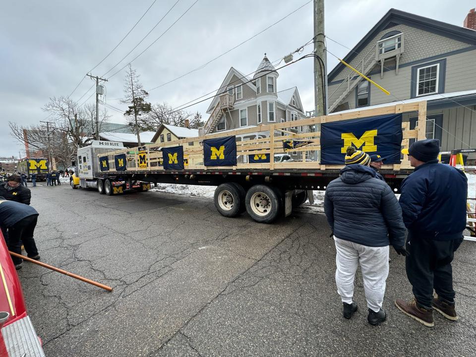Preparations begin for the University of Michigan football parade in Ann Arbor on Saturday, Jan. 13, 2024. The football team will be riding on this U-M-decorated tractor trailer.