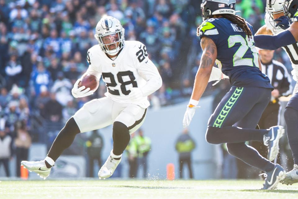 Despite battling a calf injury, Raiders running back Josh Jacobs accounted for 303 total yards in Week 12, including a game-winning 86-yard touchdown run in overtime.