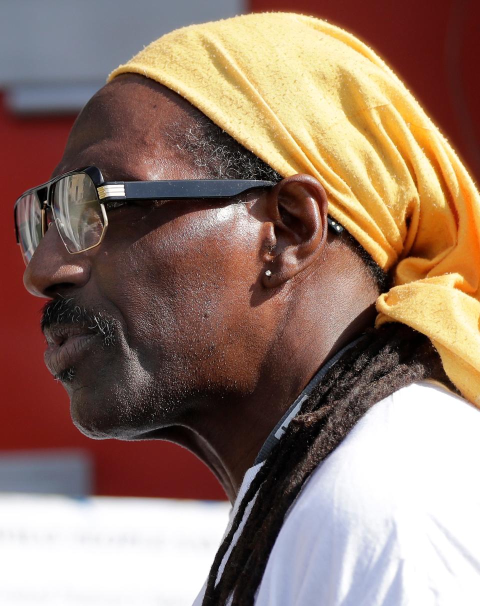 Talib Akbar, who travels with the cell, talks during a solitary confinement cell replica tour event on Thursday at St. Joseph Catholic Church in Appleton. The replica cell was part of an awareness event put on by ESTHER/WISDOM as part of their transformational justice campaign.