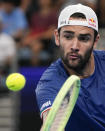 Italy's Matteo Berrettini plays a backhand return to United States' Taylor Fritz during the final of the United Cup tennis event in Sydney, Australia, Sunday, Jan. 8, 2023. (AP Photo/Mark Baker)