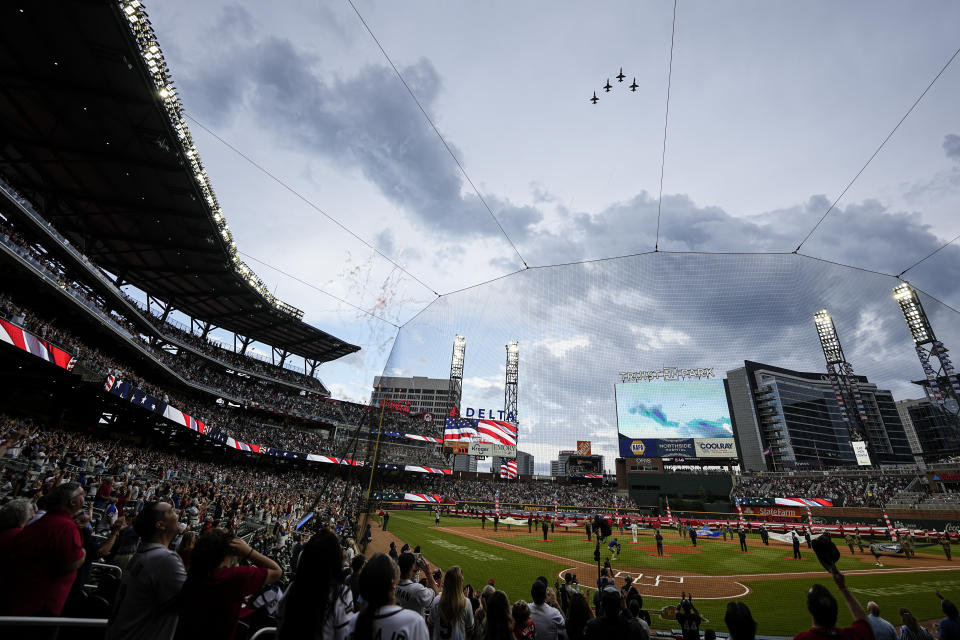 Military aircraft fly over Truist Park before a baseball game between the Atlanta Braves and the San Diego Padres, Saturday, May 18, 2024, in Atlanta. (AP Photo/Mike Stewart)