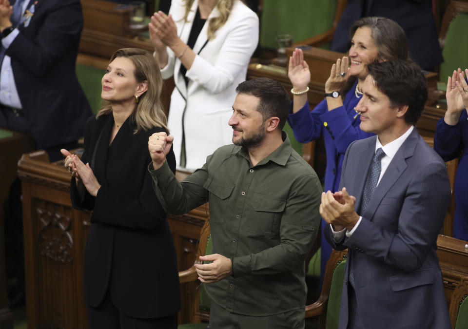 Zelensky pumps his fist and Canadian Prime Minister Justin Trudeau applauds Hunka.