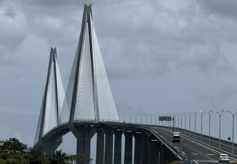 Vehicles drive over the new bridge that spans the Panama Canal, in Colon, Panama, Friday, August 2, 2019. The 4.6 km bridge spans the canal but on the Caribbean side of the country. (AP Photo/Eric Batista)