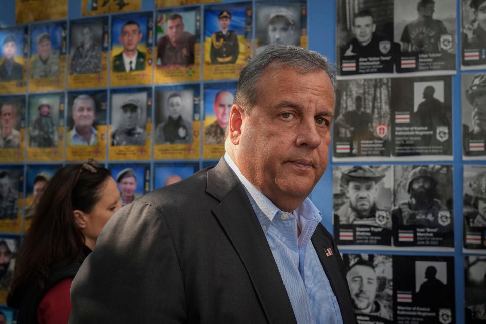 Republican presidential candidate former New Jersey Gov. Chris Christie visits the Wall of Remembrance to pay tribute to killed Ukrainian soldiers, Kyiv, Ukraine, Friday, Aug. 4, 2023.