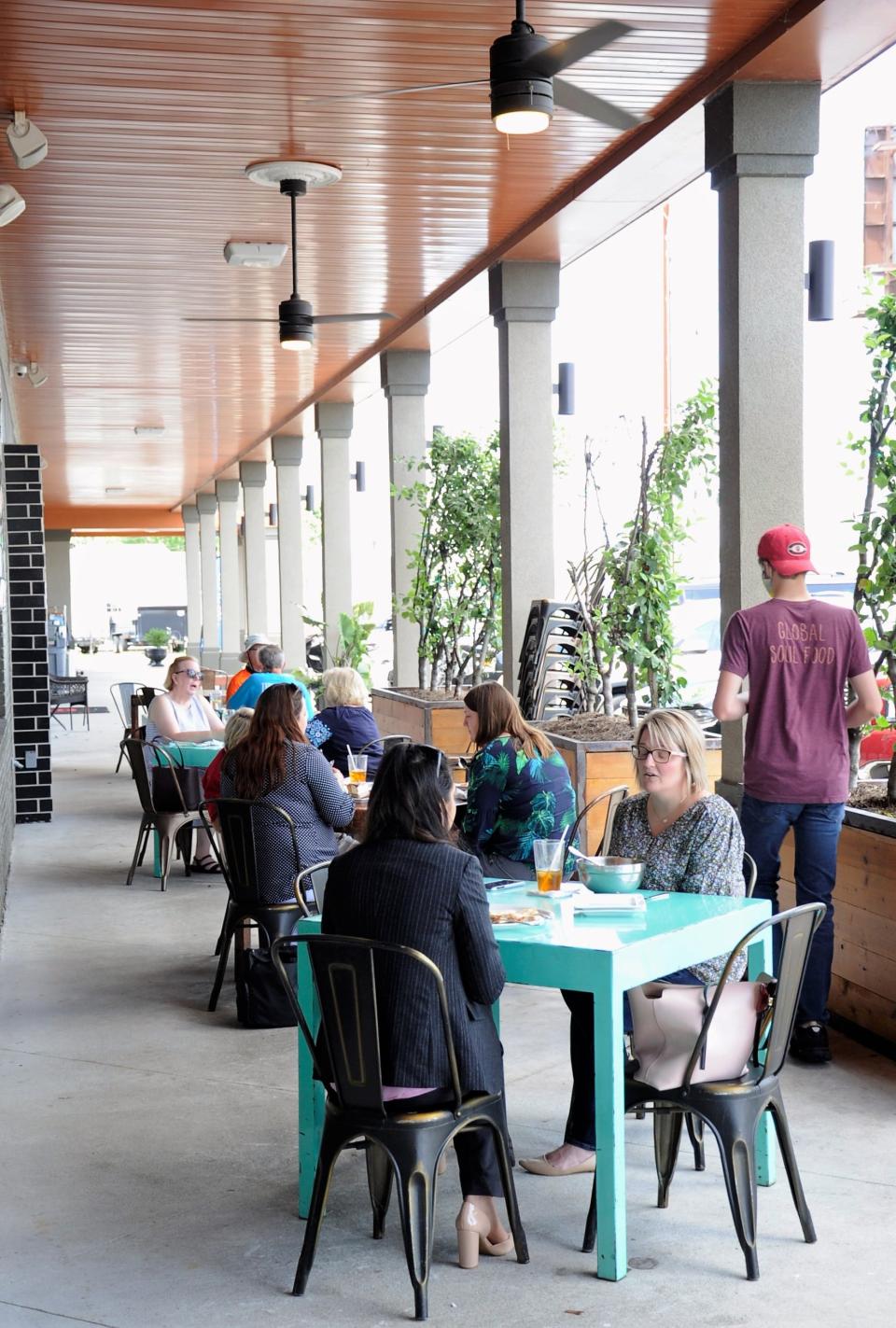 Diners enjoy extra seating on the patio at Pangea Kitchen on Evansville's East Side on Wednesday, 6-10, 2020.