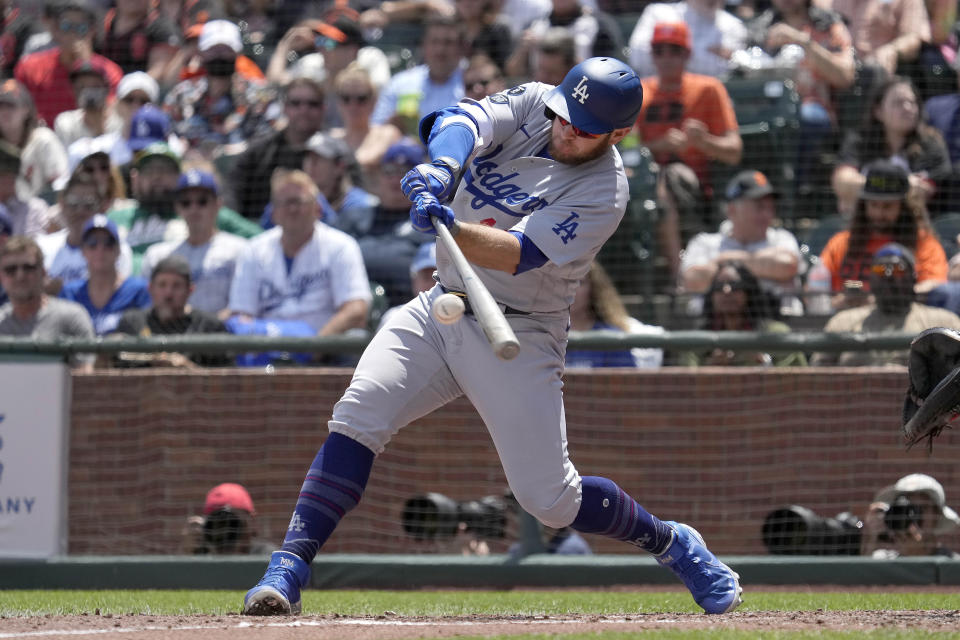 Los Angeles Dodgers' Max Muncy hits a single against the Los Angeles Dodgers during the sixth inning of a baseball game Thursday, July 29, 2021, in San Francisco. (AP Photo/Tony Avelar)