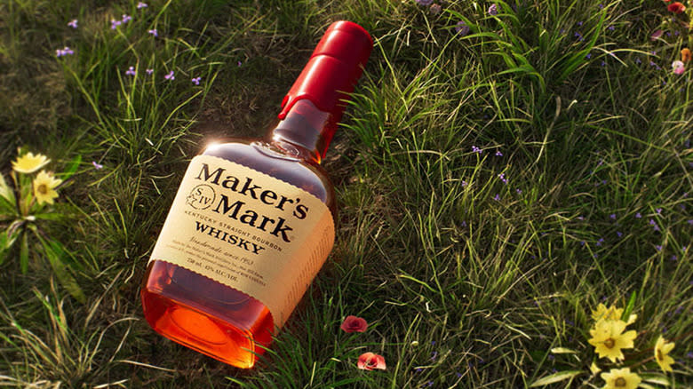 Bottle of Maker's Mark in grass