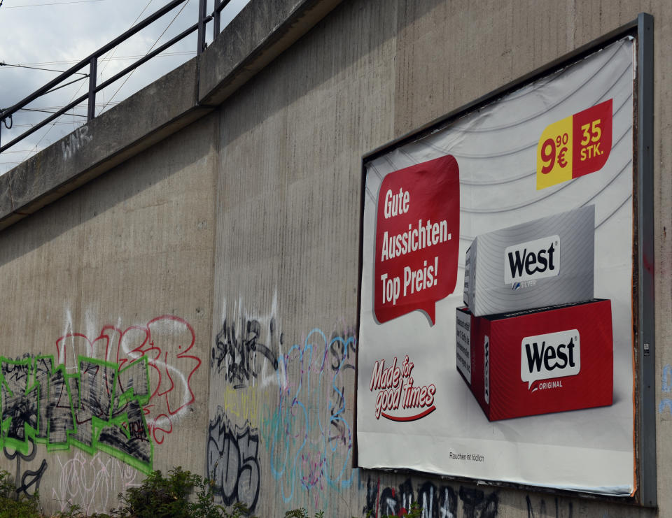 09 July 2019, North Rhine-Westphalia, Duesseldorf: A poster with tobacco advertising hangs on an underpass. Germany is the last EU country where tobacco advertising on advertising pillars and billboards is allowed. The associations of the advertising industry and the tobacco industry are trying to prevent a law banning advertising for cigarettes on advertising pillars and billboards. Photo: Horst Ossinger//dpa (Photo by Horst Ossinger/picture alliance via Getty Images)