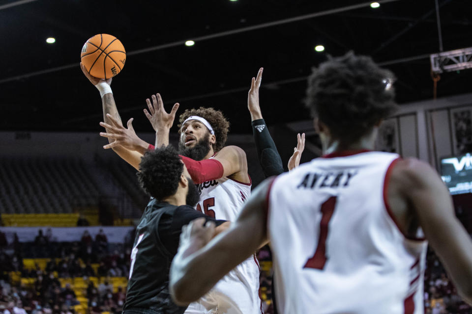 Johnny McCants (35) goes up to shoot as the New Mexico State Aggies face off against the Seattle Red Hawks at the Pan American Center in Las Cruces on Saturday, Feb. 5, 2022.