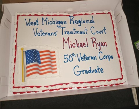 A cake celebrating Marine Corps Veteran Michael Ryan, the 50th graduate of the West Michigan Regional Veterans' Treatment Court.