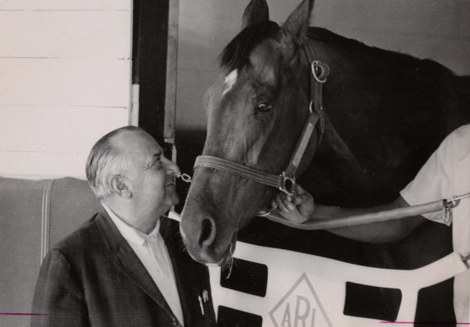 Trainer Frank Catrone admires 1965 Kentucky Derby winner Lucky Debonair as he prepares to leave for church on May 2, 1965