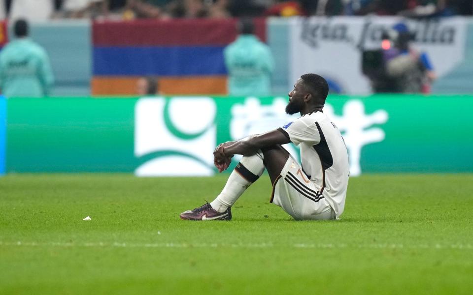 Germany's Antonio Ruediger sits on the pitch at the end of the World Cup group E soccer match between Costa Rica and Germany at the Al Bayt Stadium - Darko Bandic/AP Photo