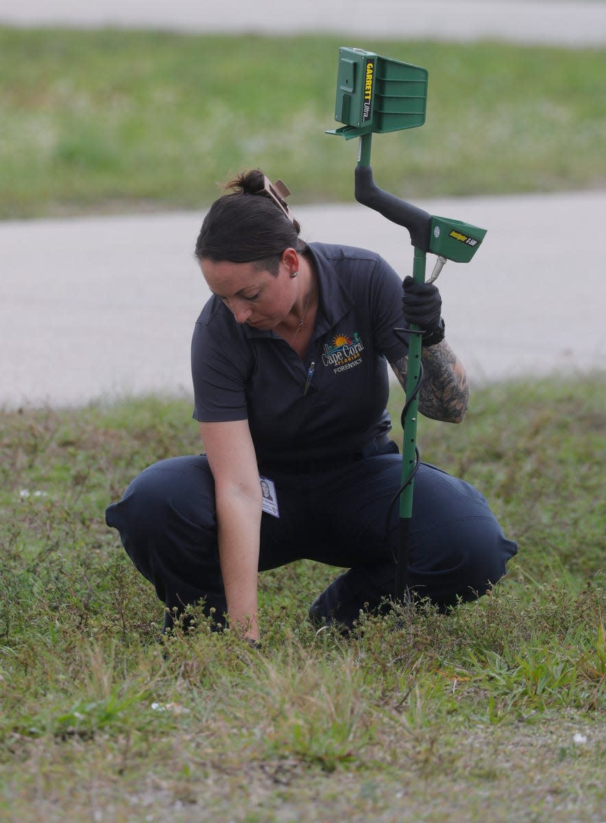 A Cape Coral Poilce Department forensics investigator searches the area near the intersection of SE 20th St. and SE 16th Ln., Monday, March 18, 2024, next to the location of a shooting Sunday night which resulted in the death of 15-yr-old Kayla Rincon-Miller.