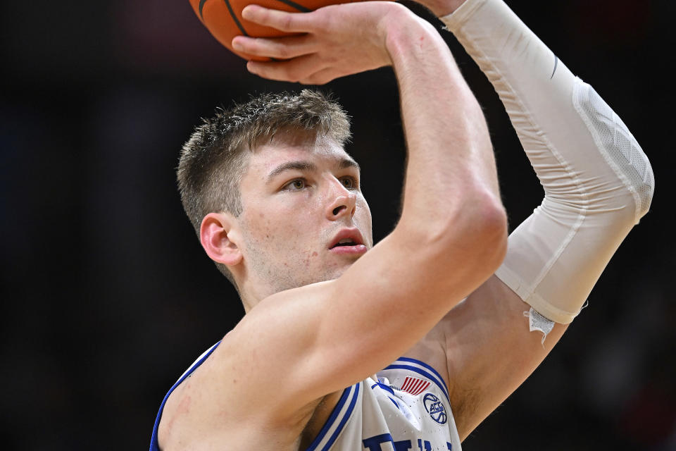 CORAL GABLES, FL - FEBRUARY 21: Duke center Kyle Filipowski (30) shoots a free throw after a technical foul in the second half as the Miami Hurricanes faced the Duke Blue Devils on February 21, 2024, at the Watsco Center in Coral Gables, Florida. (Photo by Samuel Lewis/Icon Sportswire via Getty Images)