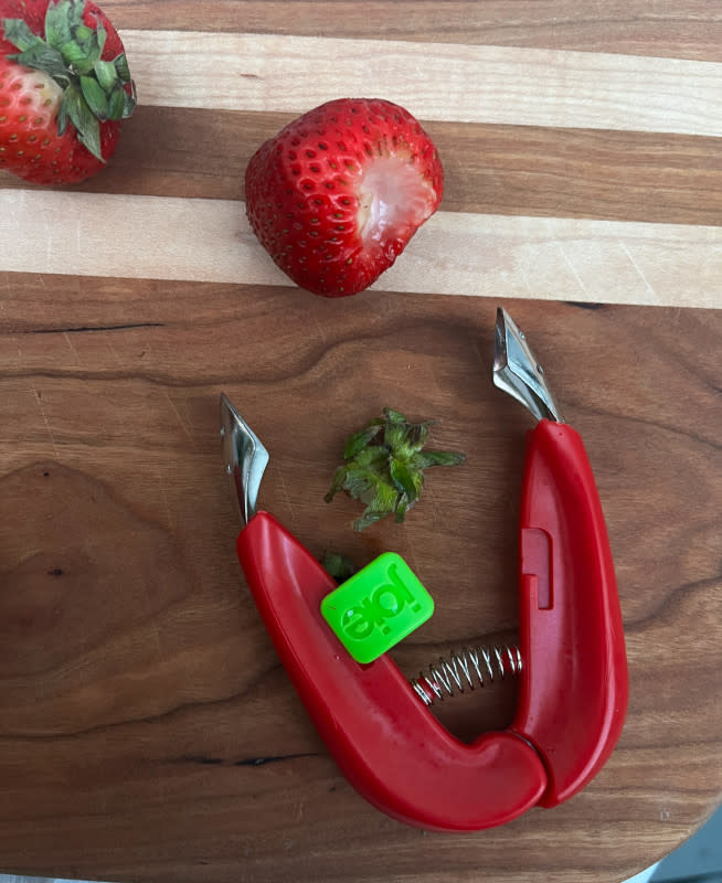 Hulling with a strawberry huller<p>Courtesy of Jessica Wrubel</p>