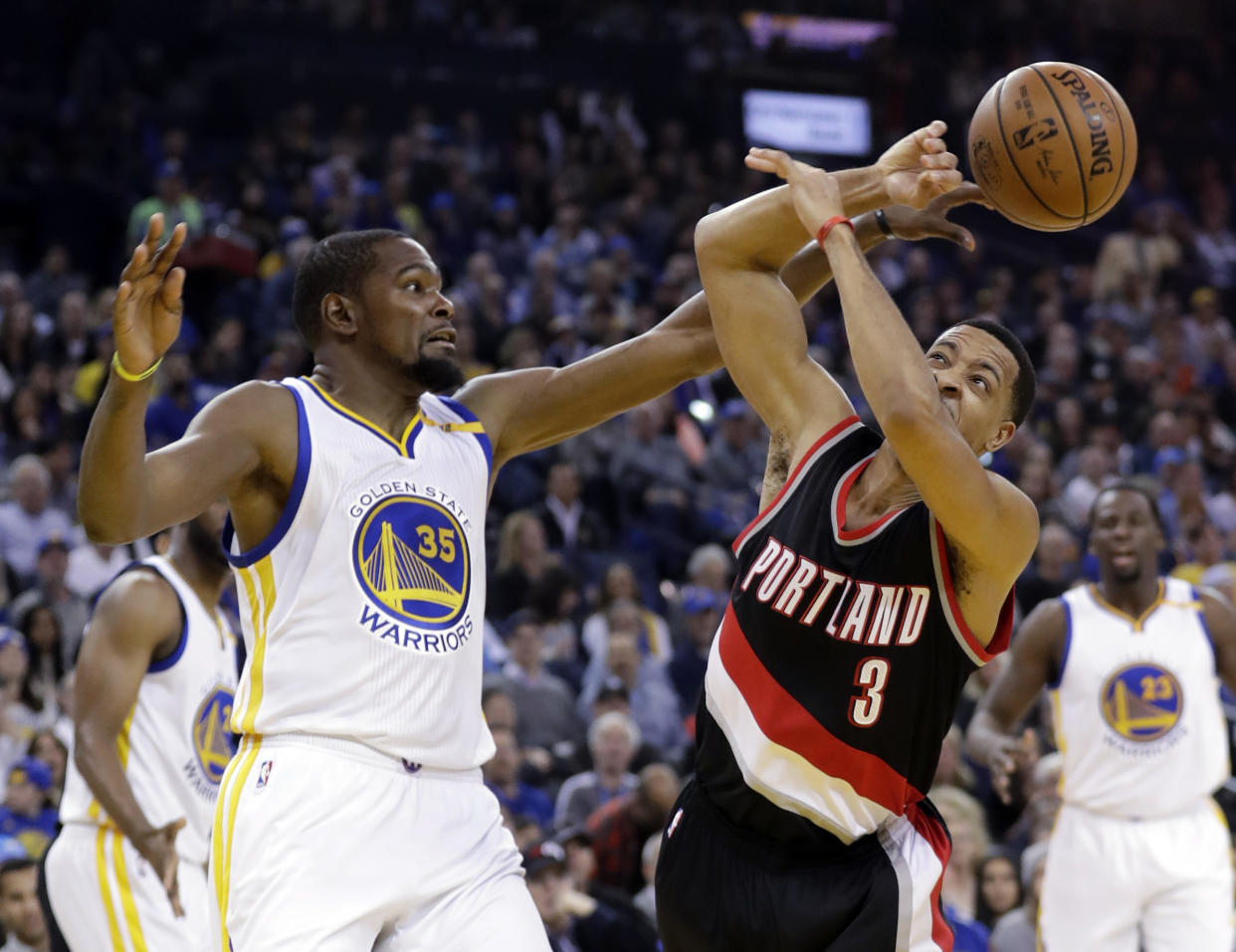 Kevin Durant and C.J. McCollum traded shots on Twitter after a tense podcast conversation. (AP)