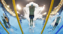 USA's Ryan Lochte competes in a men's 400-meter individual medley at the Aquatics Centre in the Olympic Park during the 2012 Summer Olympics in London, Saturday, July 28, 2012. (AP Photo/David J. Phillip)