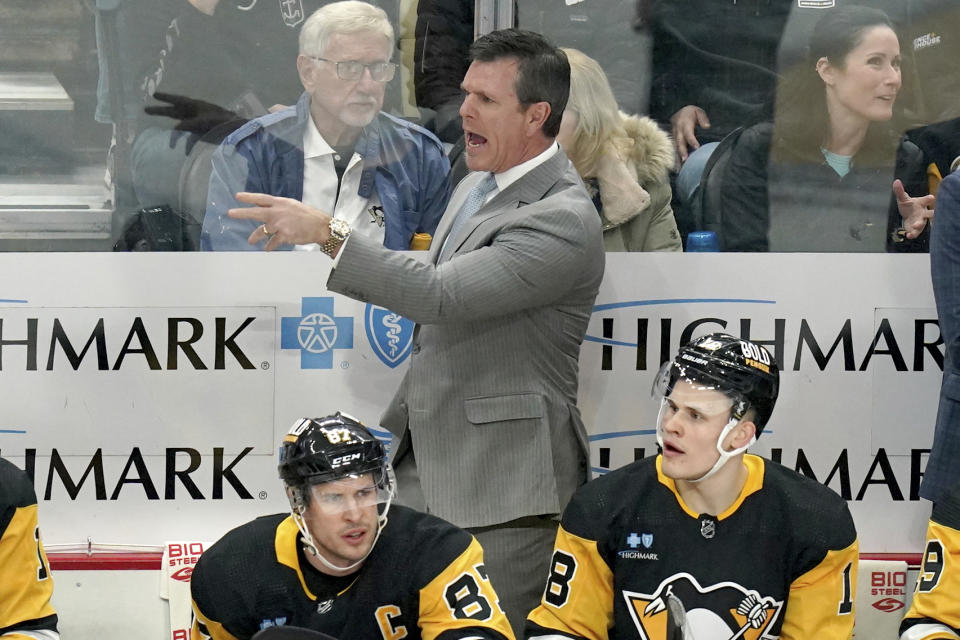 Pittsburgh Penguins head coach Mike Sullivan calls out instructions behind the bench during the first period of an NHL hockey game against the Winnipeg Jets, Tuesday, Feb. 6, 2024, in Pittsburgh. (AP Photo/Matt Freed)