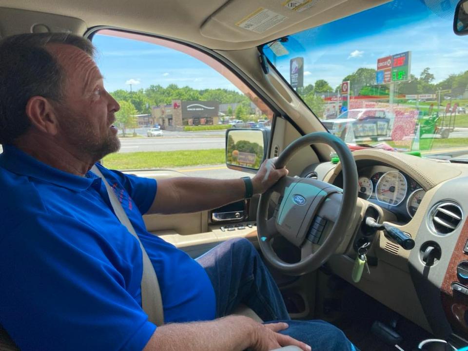 Republican primary candidate Troy Weathers of Cleveland drives through town on May 31.