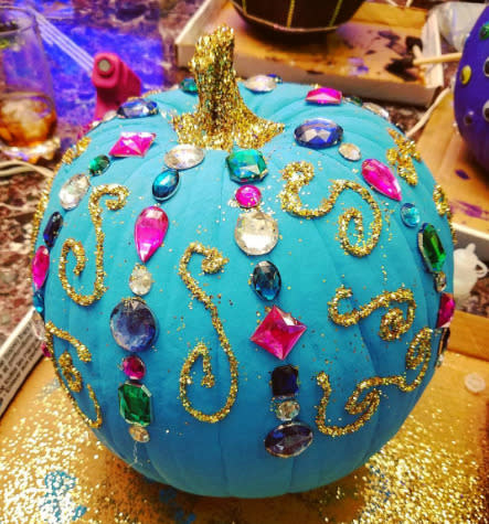 Let everyone know where the Halloween party is at by dazzling everyone with a party pumpkin, simply by glueing on some glitter and gems.