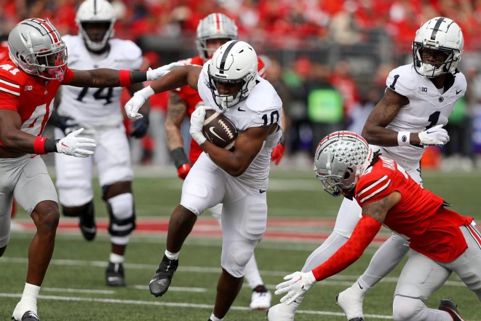 Penn State Nittany Lions running back Nicholas Singleton (10) runs the ball against the Ohio State Buckeyes during the second quarter at Ohio Stadium.