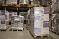 Wine cases ready for shipment sit in a warehouse in Le Cannet-des-Maures, in the Provence region, Thursday Oct. 10, 2019. European producers of premium specialty agricultural products like those protected at home for their territorial origin and sometimes centuries of artisanal know-how that fetch premium prices like French wine, are facing a U.S. tariff hike on Friday, dragged into a trade war over the fiercely competitive aerospace industry.(AP Photo/Daniel Cole)