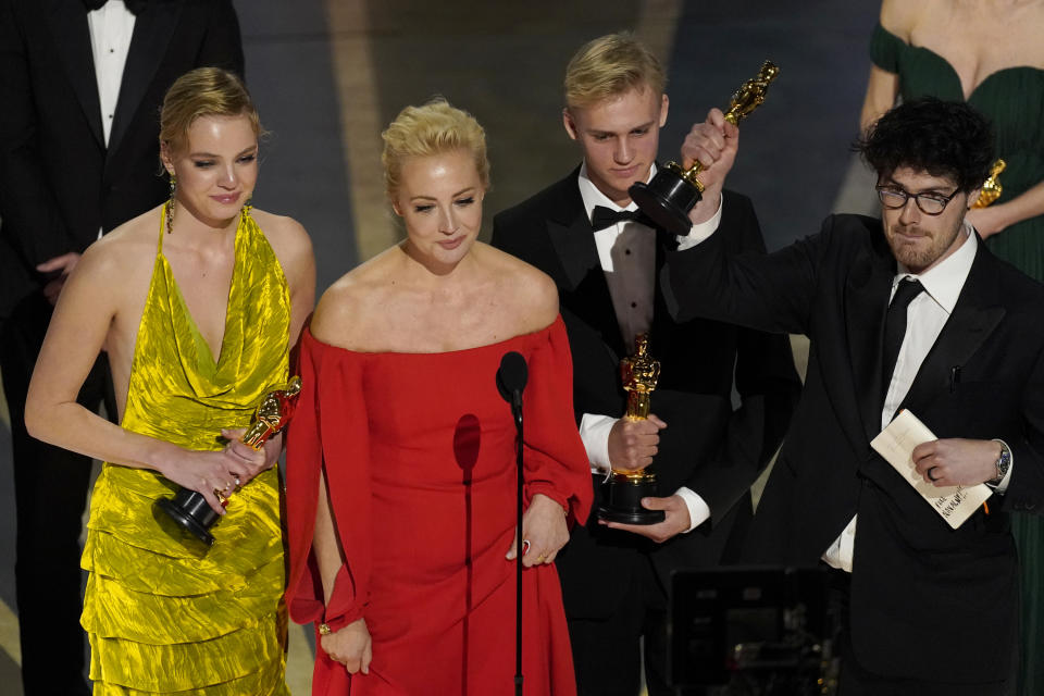 Yulia Abrosimova, second from left, and members of the crew from "Navalny" accept the award for best documentary feature film at the Oscars on Sunday, March 12, 2023, at the Dolby Theatre in Los Angeles. (AP Photo/Chris Pizzello)