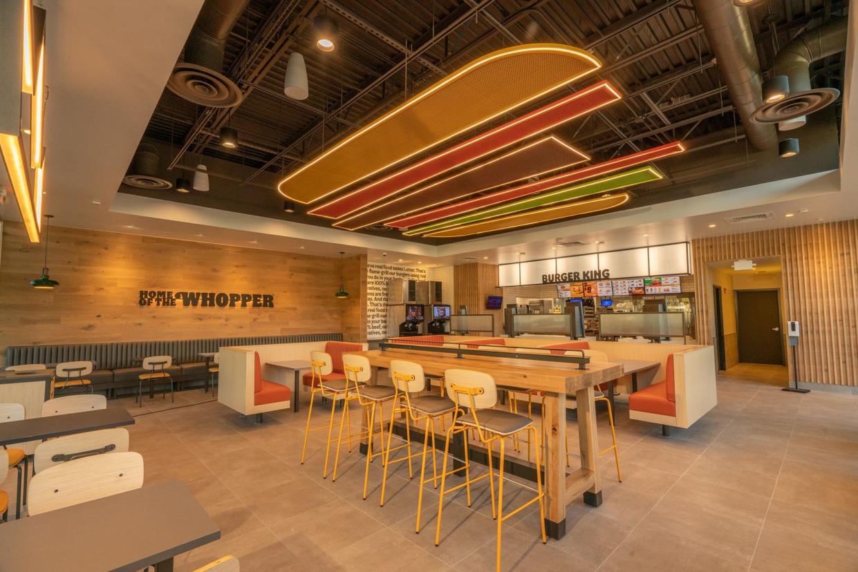 This undated promotional photo from Burger King shows an example of their latest dining area design. A new restaurant location is scheduled to open in Bogart, Ga. on Tuesday, Aug. 8, 2023.