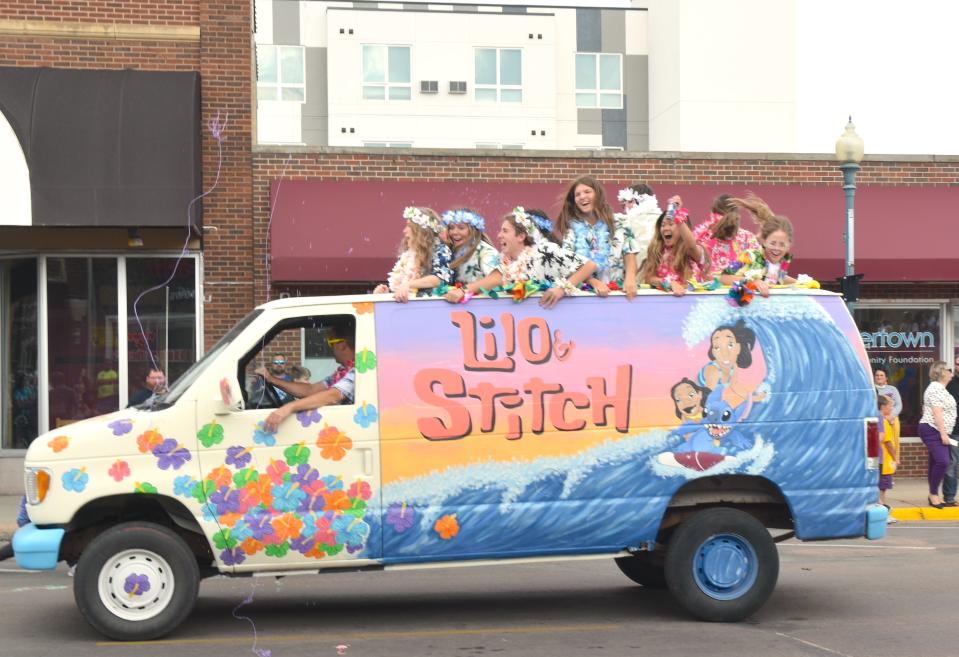 Watertown high-schoolers showed off their hard work of coloring the vans during the homecoming parade Friday.