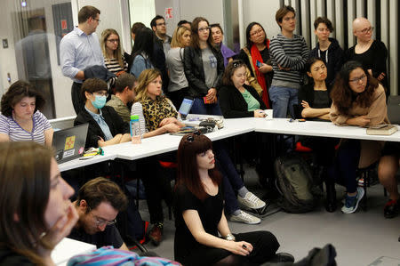 Students and faculty of the Hungary-based Central European University listen to the school's rector, Michael Ignatieff, address a town hall meeting after the government of Prime Minister Viktor Orban tabled a new bill that could force the 25-year-old school out of Hungary, in Budapest, Hungary March 29, 2017. REUTERS/Bernadett Szabo