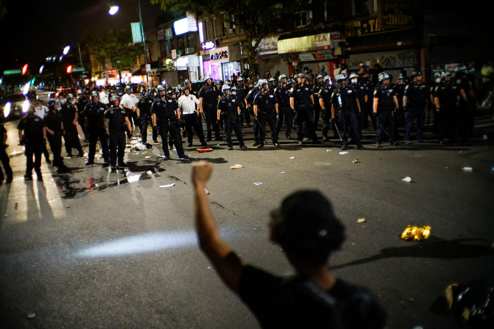 NYPD officers keep an eye on protesters in Brooklyn on Saturday while they clash during a march against the death in Minneapolis police custody of George Floyd. (Photo: Eduardo Munoz/Reuters)