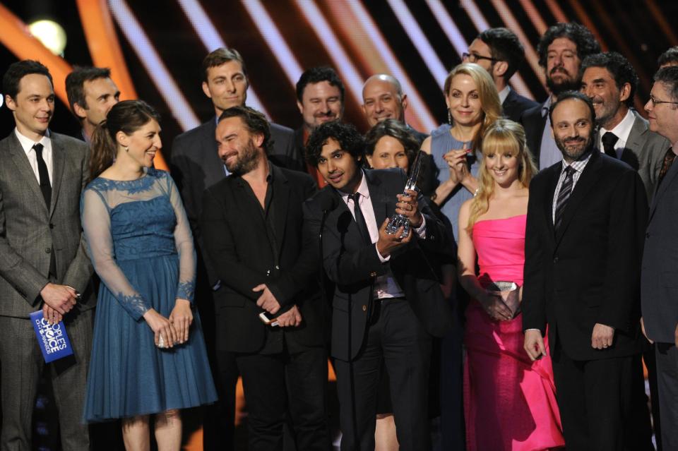 The cast and crew of “The Big Bang Theory” accepts the award for favorite network TV comedy at the 40th annual People's Choice Awards at the Nokia Theatre L.A. Live on Wednesday, Jan. 8, 2014, in Los Angeles. (Photo by Chris Pizzello/Invision/AP)