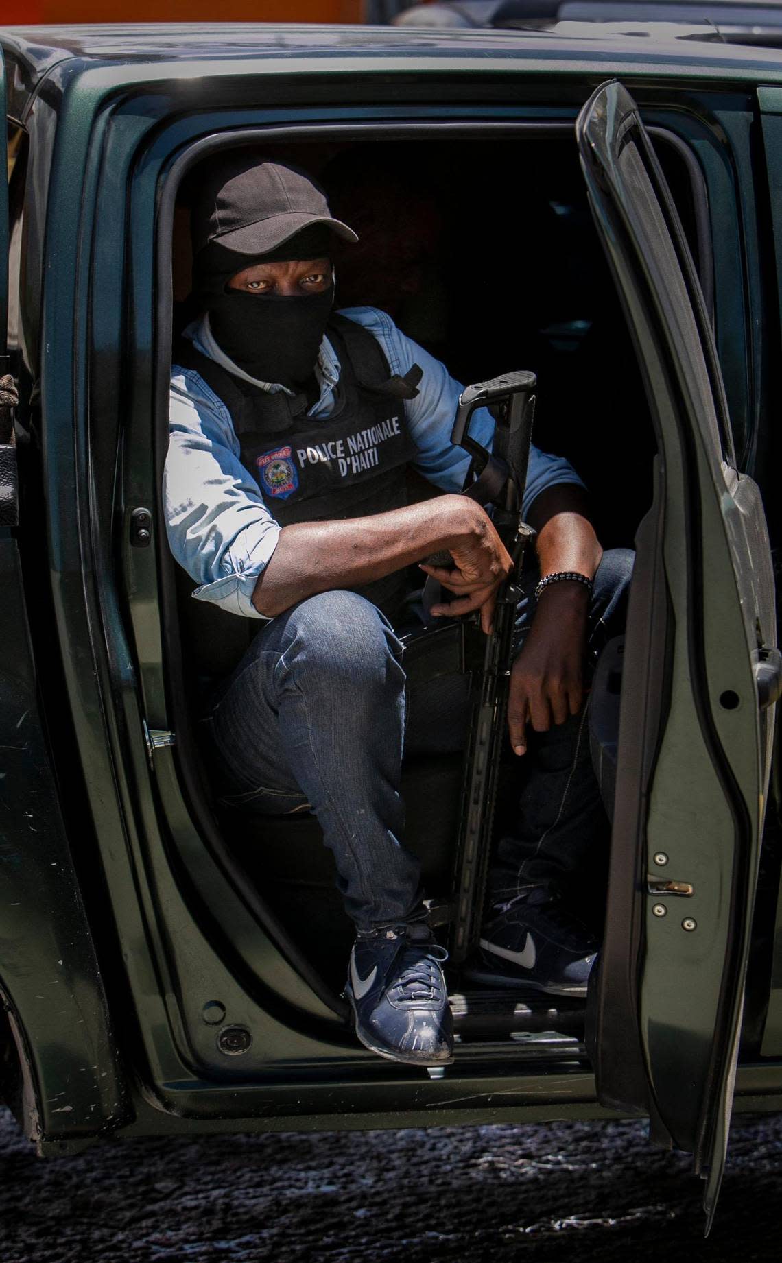 A policeman keeps watch on June 23, 2022, during a stop at a police checkpoint in Tabarre, near the U.S. Embassy.