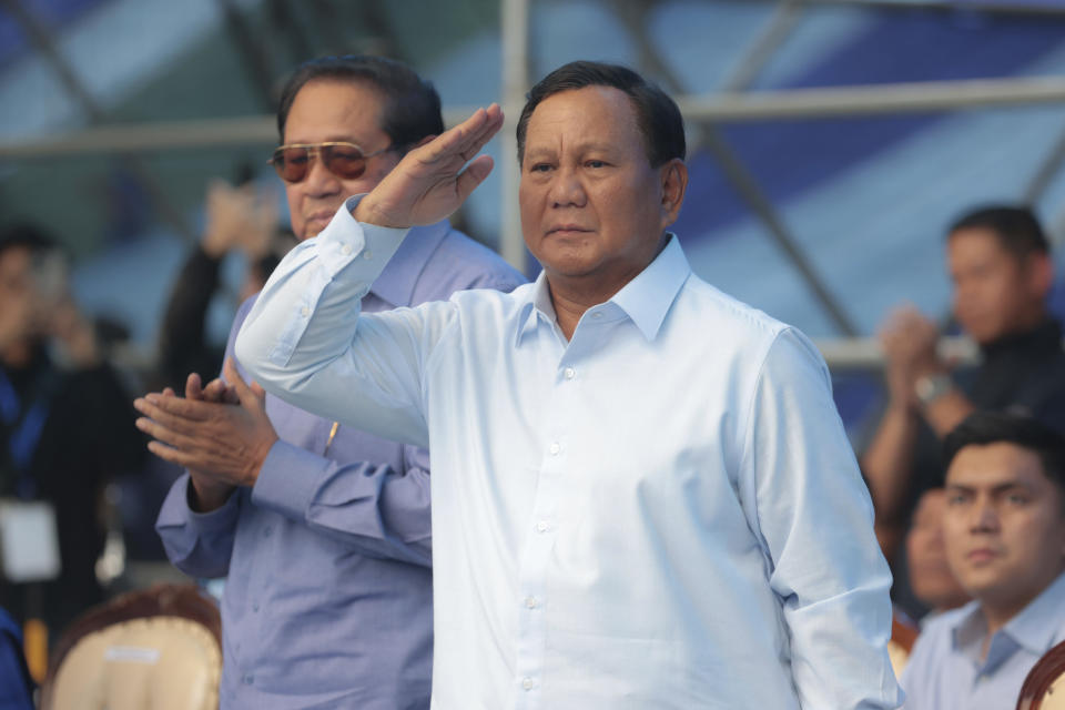 FILE - Indonesian presidential candidate Prabowo Subianto, center, gestures as he is accompanied by former President Susilo Bambang Yudhoyono, rear left, during his campaign rally in Malang, East Java, Indonesia Thursday, Feb. 1, 2024. Indonesians on Wednesday, Feb. 14, 2024 will elect the successor to popular President Joko Widodo, who is serving his second and final term. It is a three-way race for the presidency among current Defense Minister Prabowo Subianto and two former governors, Anies Baswedan and Ganjar Pranowo.(AP Photo/Trisnadi, File)