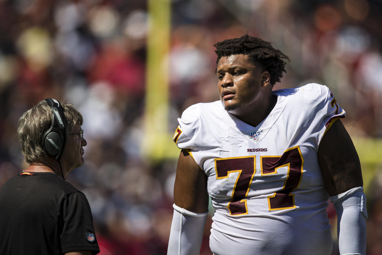 LANDOVER, MD - SEPTEMBER 15: Ereck Flowers #77 of the Washington Redskins speaks with assistant head coach and offensive line coach Bill Callahan during the first half of the game against the Dallas Cowboys at FedExField on September 15, 2019 in Landover, Maryland. (Photo by Scott Taetsch/Getty Images)
